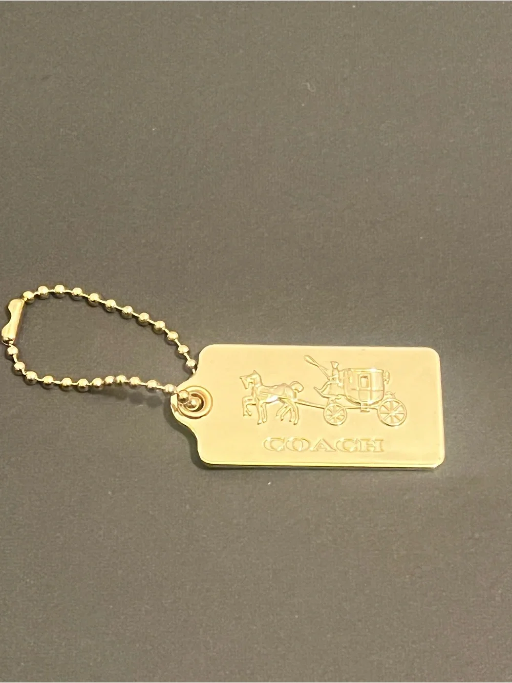 Rare Vintage Coach Gold Tone Embossed Horse & Carriage Dog-Tag Key Holder
